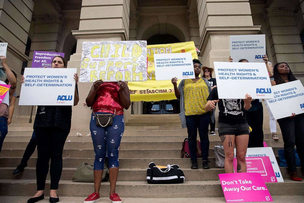 PHOTO: Abortion rights protesters rally outside of the Georgia State Capitol building following the signing of HB 481, in Atlanta, May 7, 2019.