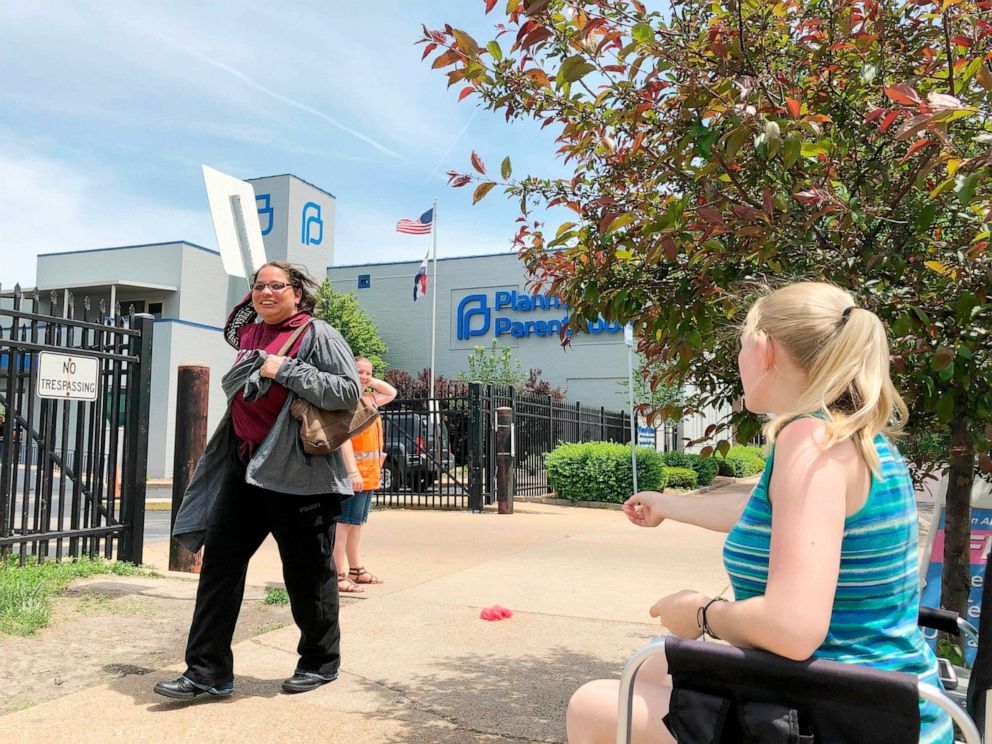 PHOTO: Teresa Pettis, 21, right, greets a passerby outside the Planned Parenthood clinic in St. Louis, Friday, May 17, 2019.