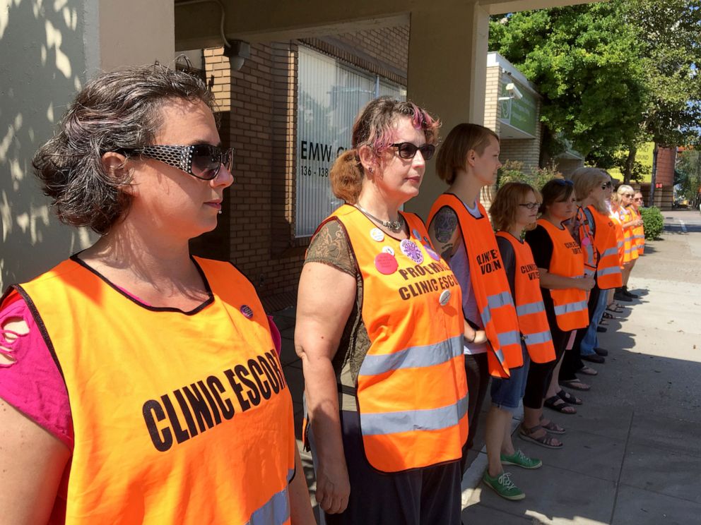 PHOTO: Escort volunteers queue in front of the EMW Women's Surgery Center in Louisville, Kentucky on July 17, 2017. 