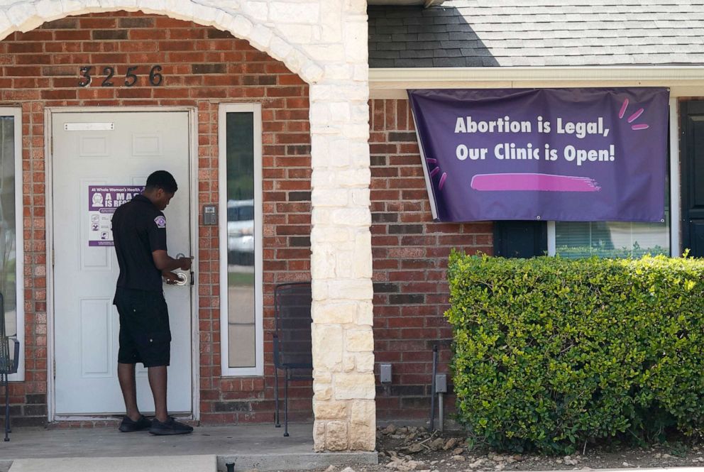 PHOTO: A security guard opens the door to the Whole Women's Health Clinic in Fort Worth, Texas, Wednesday, Sept. 1, 2021. A Texas law banning most abortions in the state took effect at midnight, but the Supreme Court has yet to act on an emergency appeal.