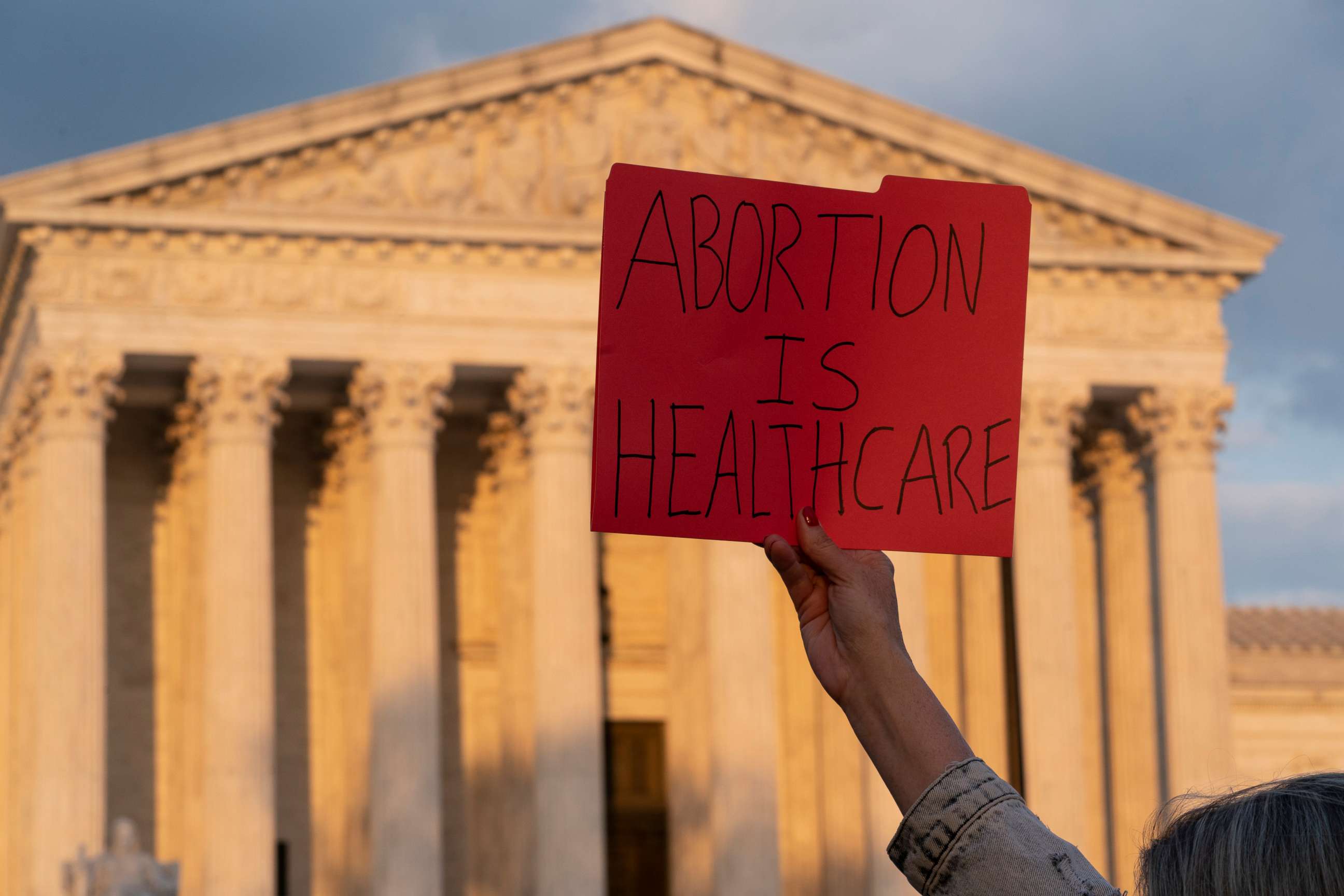 PHOTO: Demonstrators protest outside of the U.S. Supreme Court, Wednesday, May 4, 2022, in Washington. 