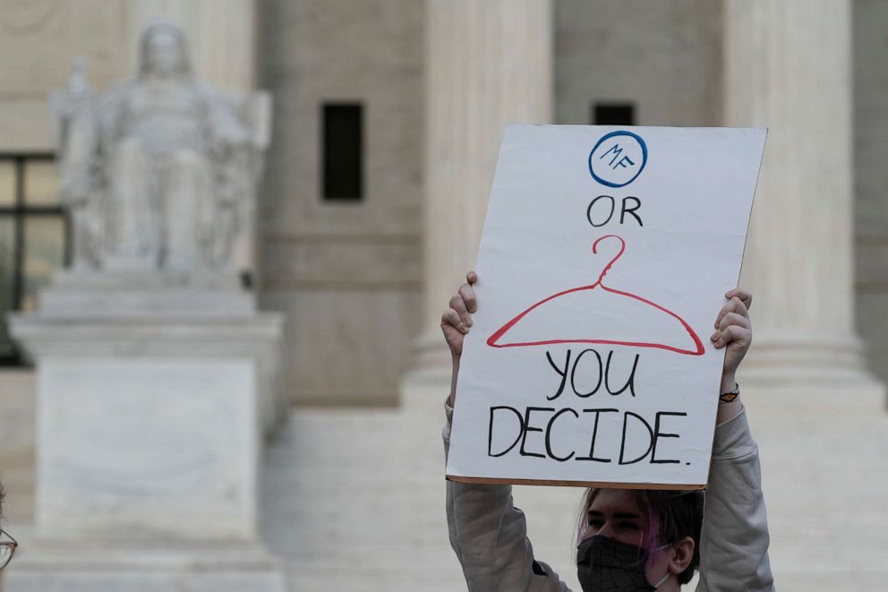 PHOTO: Demonstrators protest outside of the U.S. Supreme Court Wednesday, May 4, 2022 in Washington. A draft opinion suggests the U.S. Supreme Court could be poised to overturn the landmark 1973 Roe v. Wade case that legalized abortion nationwide.