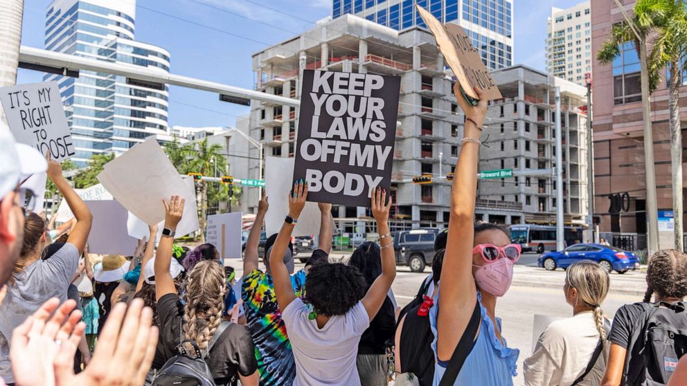 PHOTO: An abortion rights activist holds a sign at a protest in support of abortion access, on July 13, 2022 in Fort Lauderdale, Fla.  
