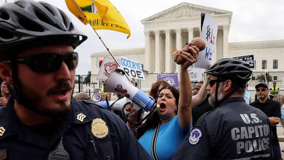 PHOTO: Police officers try to separate abortion rights supporters and anti-abortion protesters outside the United States Supreme Court in Washington, D.C., June 21, 2022.