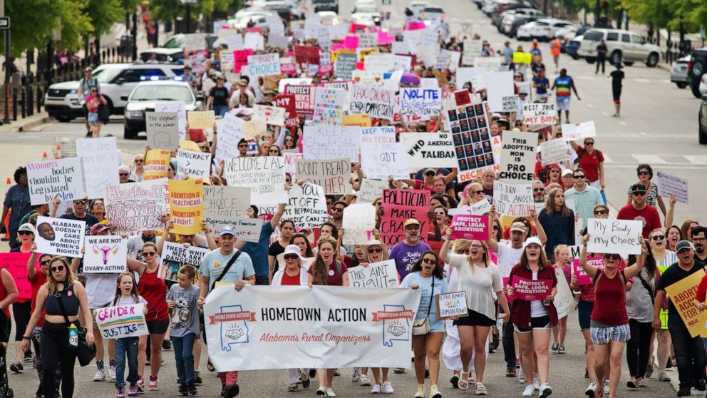 PHOTO: People walk to the Alabama State Capitol during the March for Reproductive Freedom against the state's new abortion law, the Alabama Human Life Protection Act, in Montgomery, Alabama, May 19, 2019.
