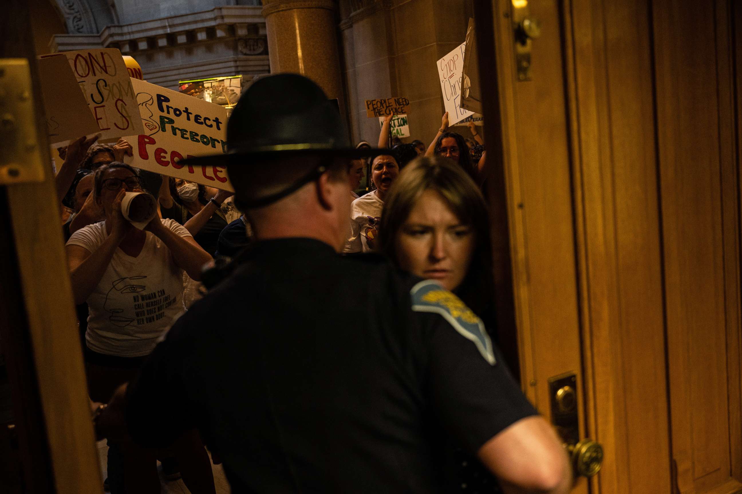 PHOTO: Abortion rights protesters attempt to force their way into the Senate chamber of Indiana State Capitol building, July 25, 2022, in Indianapolis.