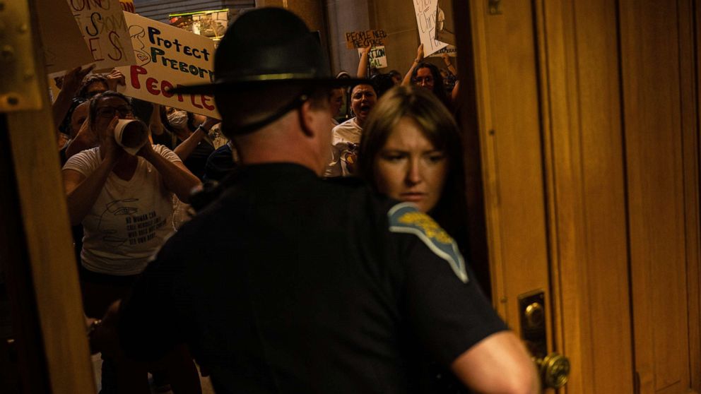 PHOTO: Abortion rights protesters attempt to force their way into the Senate chamber of the Indiana State Capitol building, July 25, 2022, in Indianapolis.