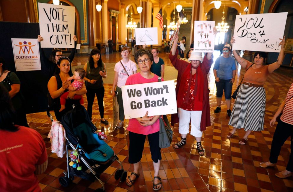 PHOTO: In this May 4, 2018, file photo, protesters rally outside Iowa Gov. Kim Reynolds' formal office, at the Statehouse in Des Moines, Iowa.
