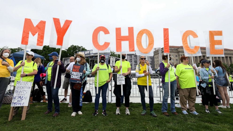 PHOTO: Abortion rights activists participate in a Bans Off Our Bodies rally at the base of the Washington Monument on May 14, 2022 in Washington, DC.