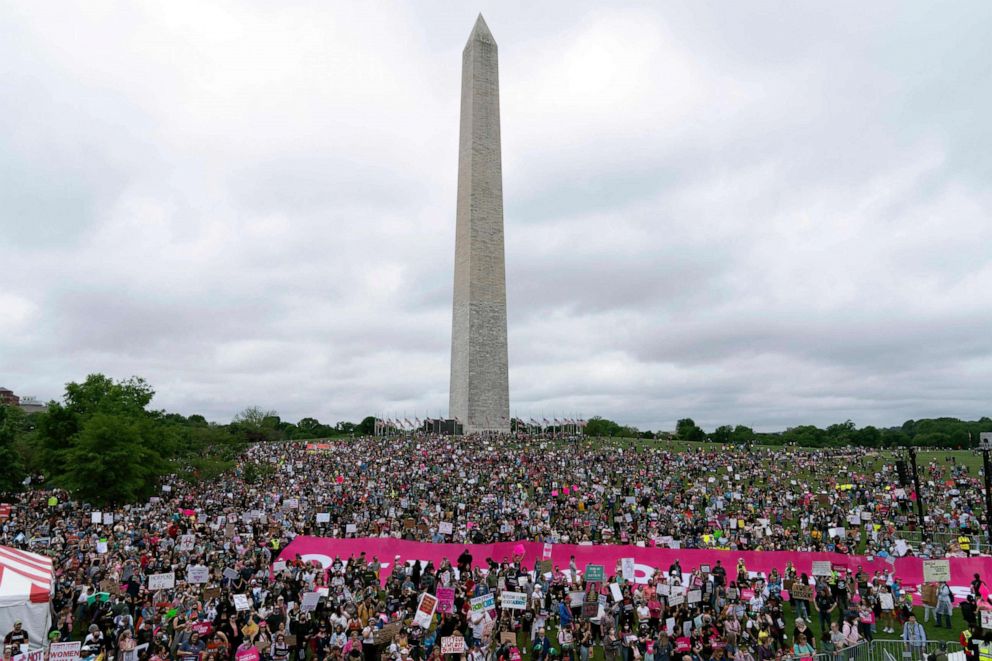 PHOTO: Abortion rights activist rally at the Washington Monument before a march to the US Supreme Court in Washington, DC, May 14, 2022.