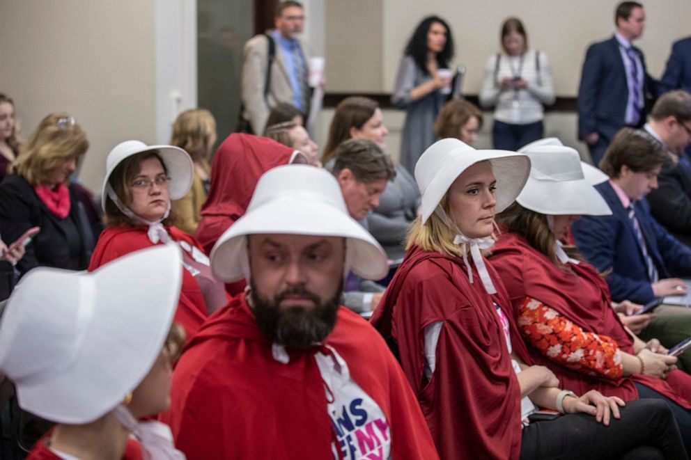 PHOTO: Opponents of two anti-abortion bills in the Kentucky House Judiciary Committee dress as characters from the Handmaid's Tale during a hearing at the Kentucky state Capitol in Frankfort, Ky., March 4, 2020.