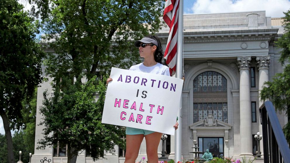 PHOTO: An abortion-rights demonstrator holds a sign in front of the Hamilton County Court House on May 14, 2022, in Chattanooga, Tenn.On June 28, a federal court  allowed Tennessee's ban on abortion as early as six weeks into pregnancy to take effect.