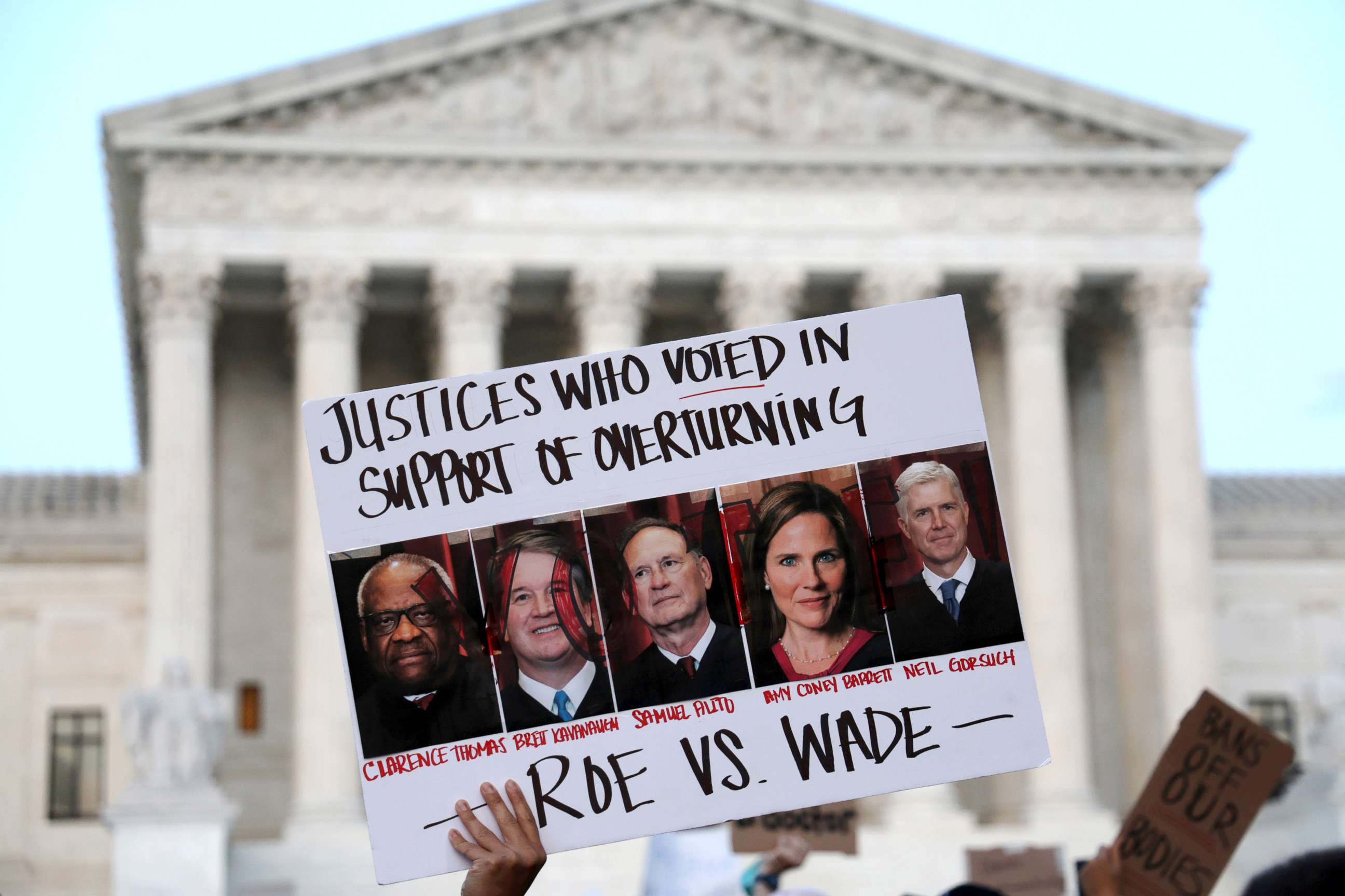 PHOTO: A pro-choice activist holds up a sign during a rally in front of the U.S. Supreme Court in response to the leaked Supreme Court draft decision to overturn Roe v. Wade May 3, 2022 in Washington, D.C.