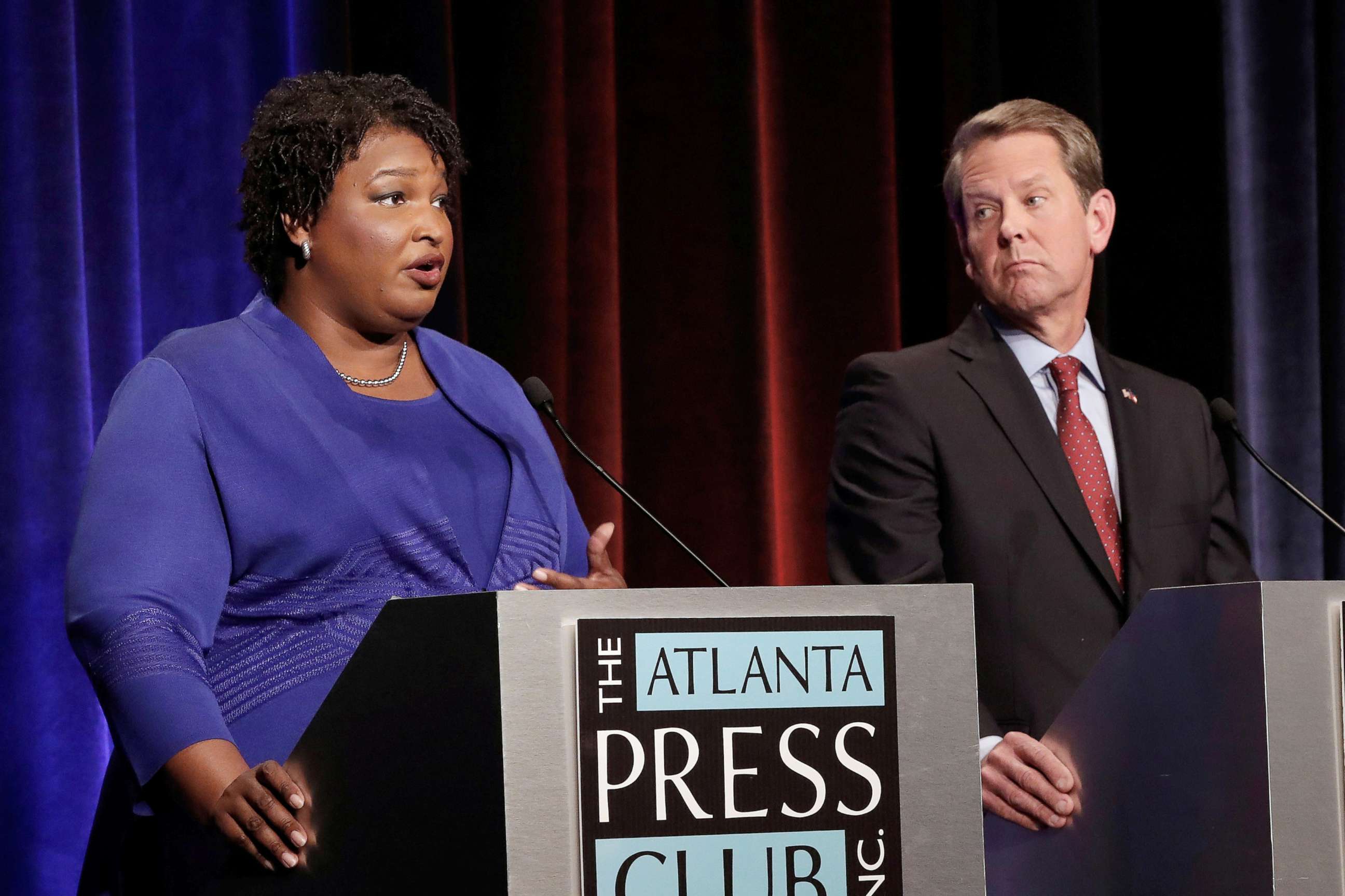 PHOTO: Democratic gubernatorial candidate for Georgia Stacey Abrams speaks, as Republican candidate Brian Kemp looks on, during a debate in Atlanta, Oct. 23, 2018.