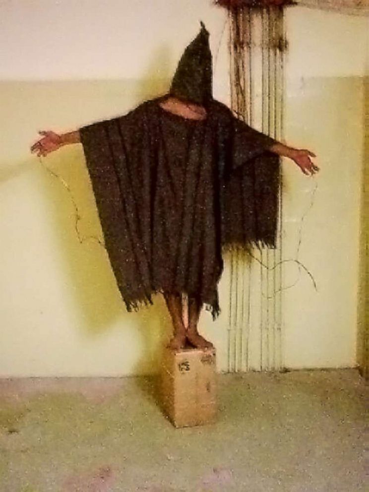 PHOTO: An unidentified detainee stands on a box with a bag on his head and wires attached to him at the Abu Ghraib prison in Baghdad, Iraq, in an image obtained by The Associated Press in 2008.
