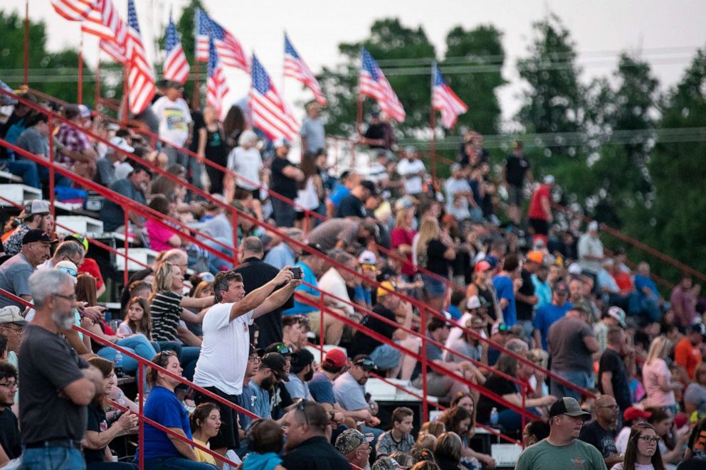 PHOTO: Attendees cheer and take photos during a race at Ace Speedway on May 30, 2020 in Altamahaw, North Carolina. 