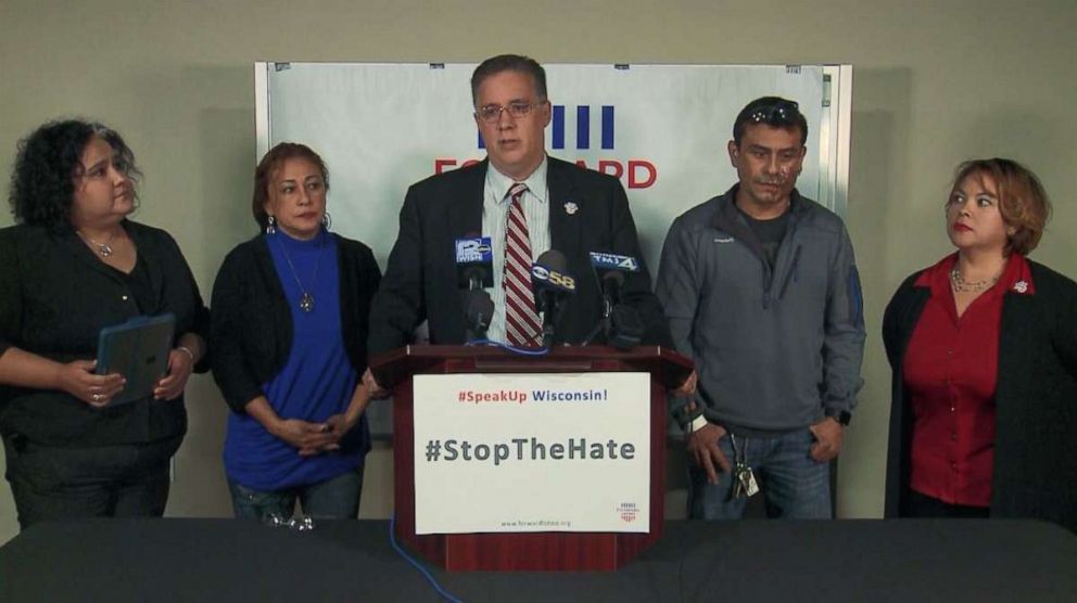 PHOTO: Darryl Morin, president and chairman of the board for Forward Latino, speaks at a press conference Saturday, Nov. 2, 2019, after Mahud Villalaz, second from right, had acid thrown in his face in Milwaukee, Wis.