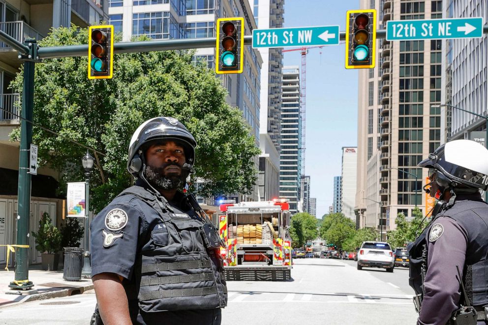 PHOTO: Law enforcement officers block the road near the scene of an active shooter, May 3, 2023 in Atlanta.