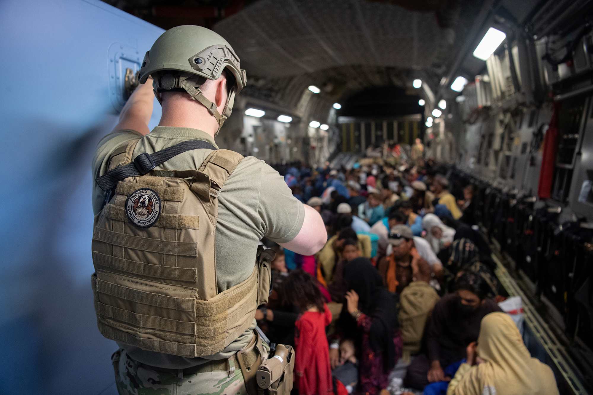 PHOTO: A U.S. Air Force security forces raven maintains security aboard a U.S. Air Force C-17 Globemaster III aircraft in support of the Afghanistan evacuation at Hamid Karzai International Airport in Kabul, Afghanistan, Aug. 24, 2021. 