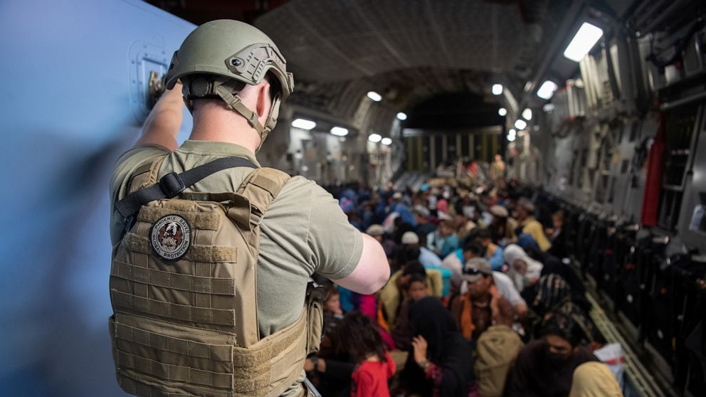 PHOTO: A U.S. Air Force security forces raven maintains security aboard a U.S. Air Force C-17 Globemaster III aircraft in support of the Afghanistan evacuation at Hamid Karzai International Airport in Kabul, Afghanistan, Aug. 24, 2021. 