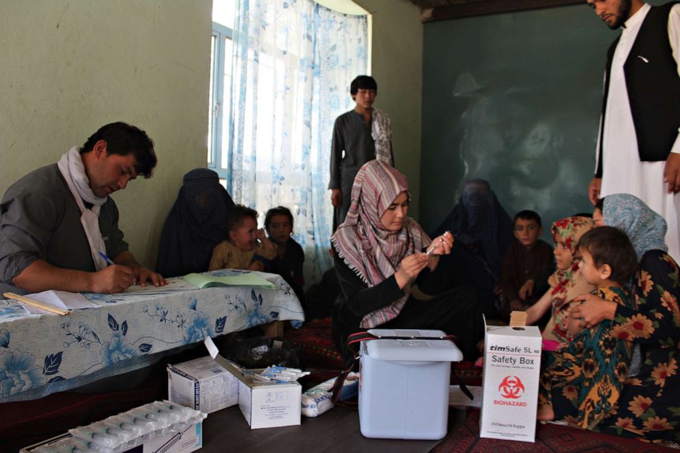 PHOTO: Health workers in Badakhshan provide measles vaccines to children on Sept. 2,  2018.