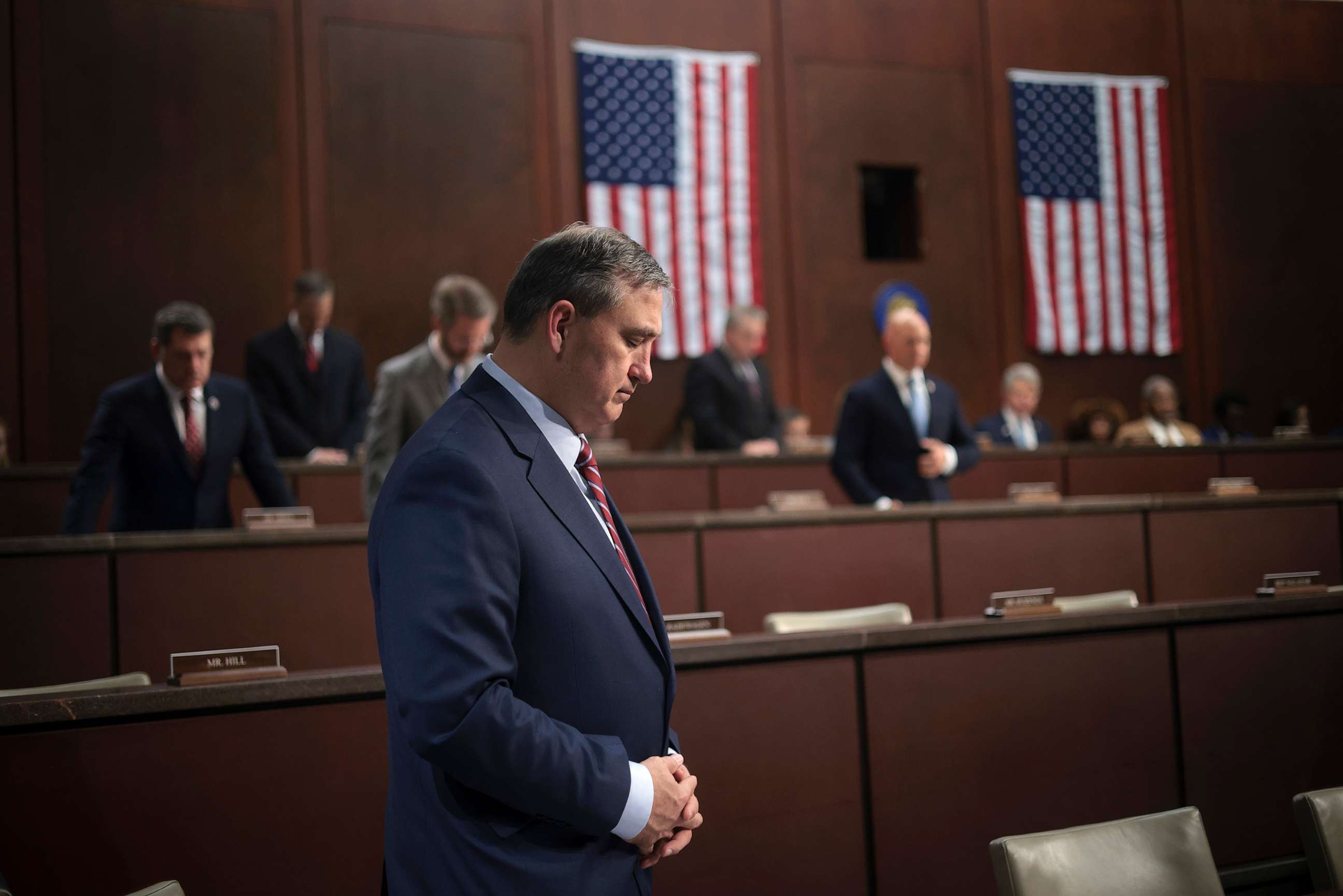 PHOTO: Members of the the House Foreign Affairs Committee stand in silence in memory of the 13 members of the U.S. military who were killed while defending an attack on airport in Afghanistan at the U.S. Capitol on March 8, 2023 in Washington, D.C.