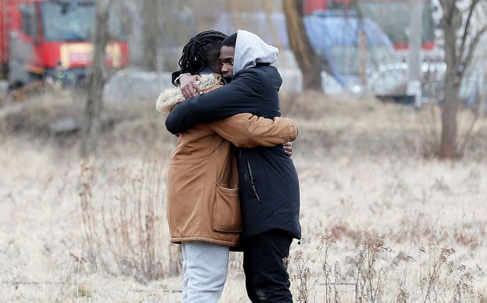 PHOTO: Two African students from Eswatini (Swaziland) comfort each-other after they managed to cross the Romanian-Ukrainian border crossing in Siret, northern Romania, Feb. 27, 2022.