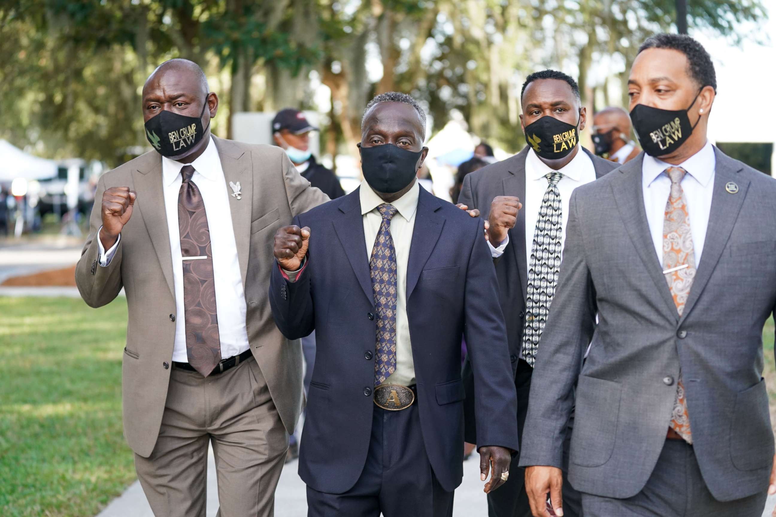 PHOTO: Attorney Ben Crump, left, and Marcus Arbery Sr., the father of Ahmaud Arbery, second from left, arrive at the Glynn County Courthouse as jury selection begins for the trial of the shooting death of Ahmaud Arbery on Oct. 18, 2021, in Brunswick, Ga.