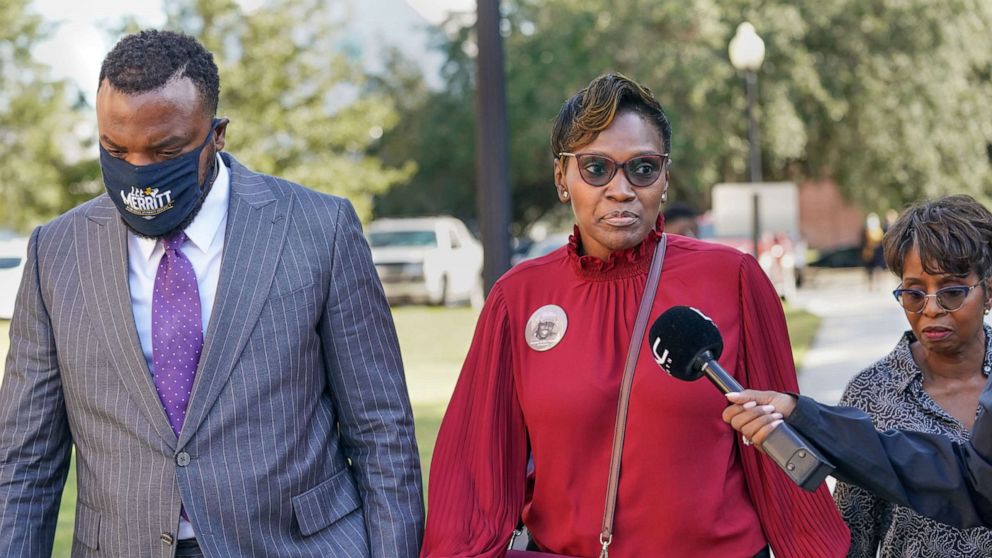 PHOTO: Wanda Cooper-Jones, mother of Ahmaud Arbery, right, and attorney Lee Merritt arrive at the Glynn County Courthouse as jury selection begins for the trial of the shooting death of Ahmaud Arbery on Oct. 18, 2021, in Brunswick, Ga.