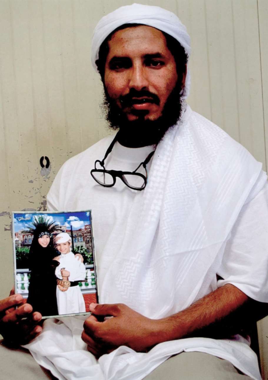 PHOTO: Al-Darbi from Saudi Arabia holds a photograph of his children as he sits for a portrait inside the detention center at the U.S. base at Guantanamo Bay, Cuba. The Pentagon said Wednesday, May 2, 2018.