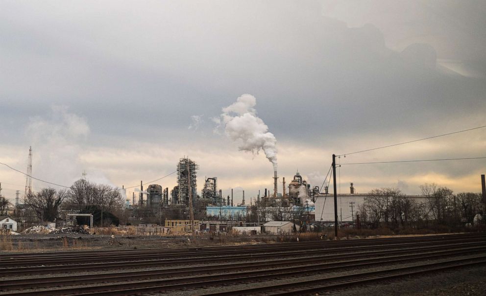 PHOTO: Industrial pollution pours from an oil refinery, Jan. 8, 2021, near New Castle, Del. 