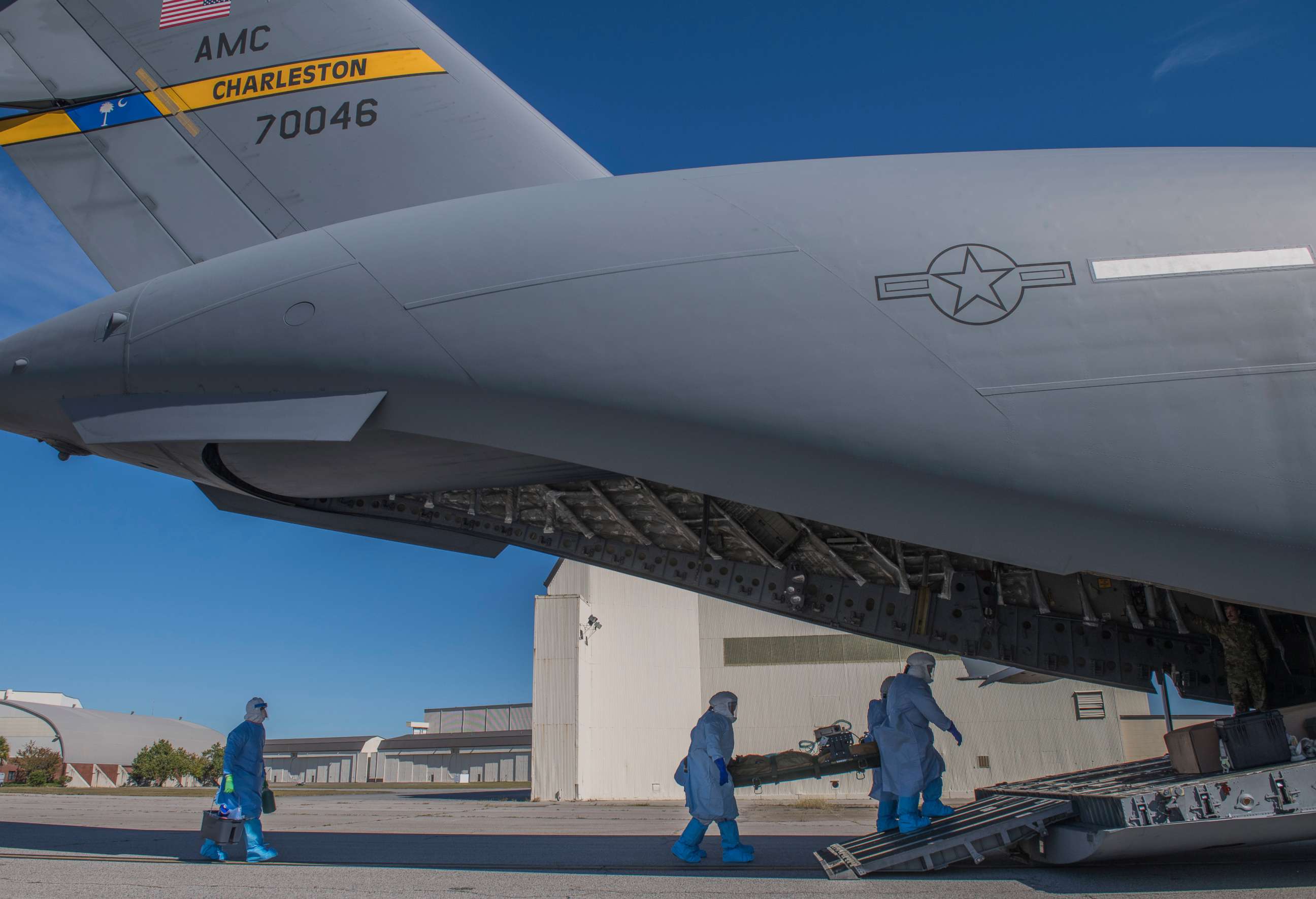 PHOTO: Members of the 43rd Aeromedical Evacuation Squadron from Pope Army Air Field, N.C., and 375th AES from Scott Air Force Base, Ill. carry a simulated Ebola patient at Joint Base Charleston, S.C., October 23, 2019.