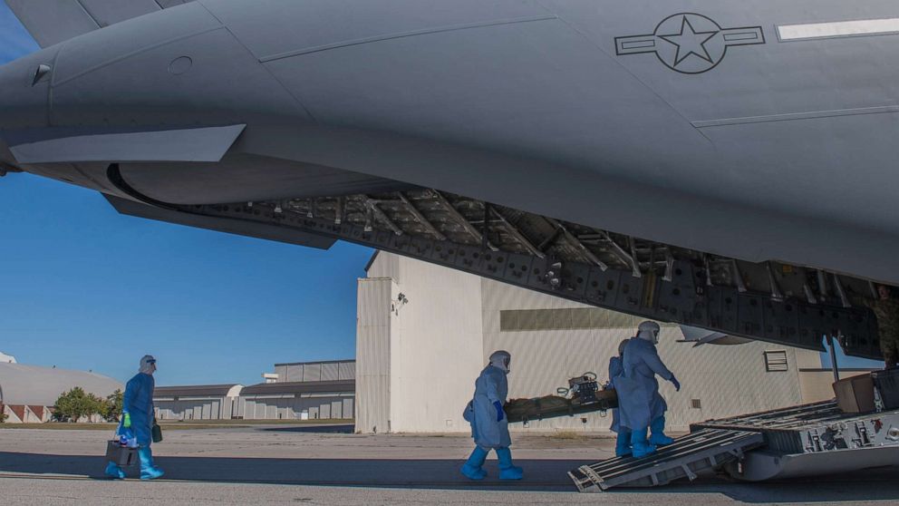 PHOTO: Members of the 43rd Aeromedical Evacuation Squadron from Pope Army Air Field, N.C., and 375th AES from Scott Air Force Base, Ill. carry a simulated Ebola patient at Joint Base Charleston, S.C., October 23, 2019.