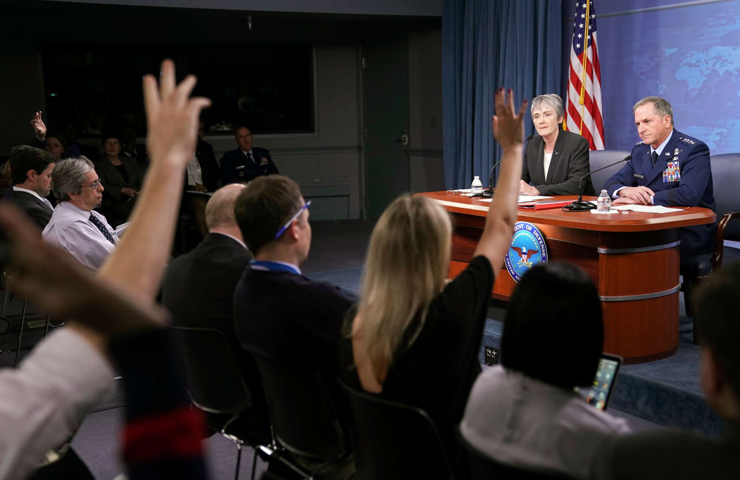 PHOTO: Journalist raise their hands during a news briefing by Gen. David L. Goldfein, far right, Chief of Staff of the U.S. Air Force and Air Force Secretary Heather Wilson at the Pentagon, Nov. 9, 2017.