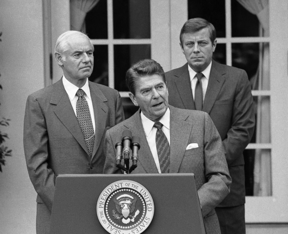 PHOTO: President Ronald Reagan, flanked by Attorney General William French Smith and Transportation Secretary Drew Lewis, speaks during a briefing in the White House Rose Garden in Washington, Aug. 3, 1981.