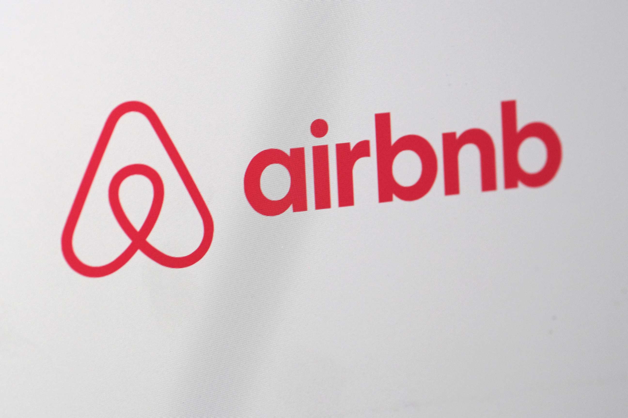 PHOTO: A logo of Airbnb is is displayed on a computer screen, April 20, 2020.