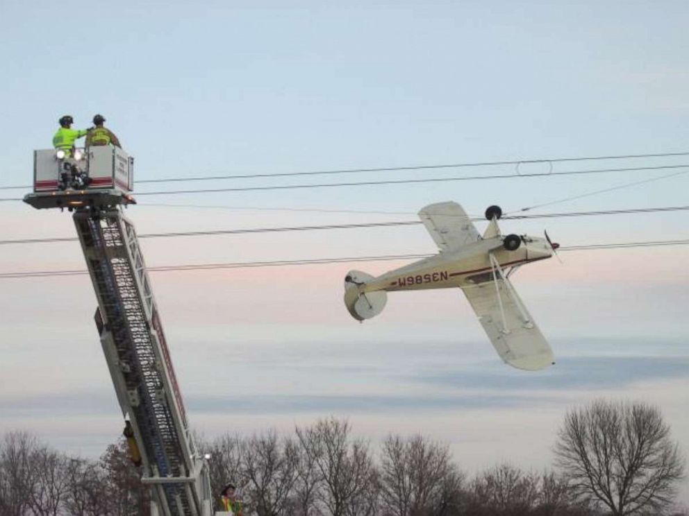 PHOTO: The pilot of a small plane was rescued after it crashed into a power line in Louisville Township, Minnesota.