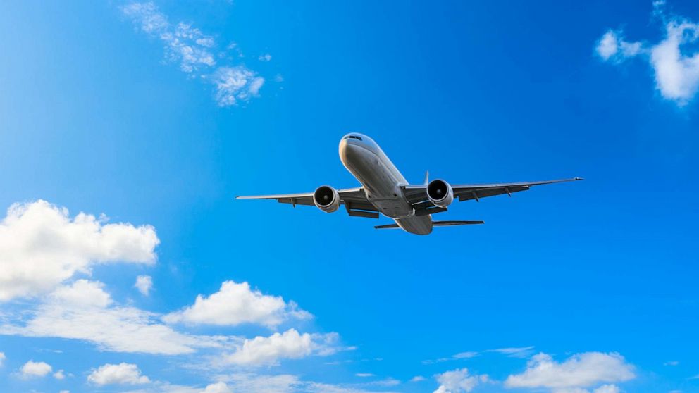 PHOTO: In an undated stock photo, a plane is shown flying in a blue sky.