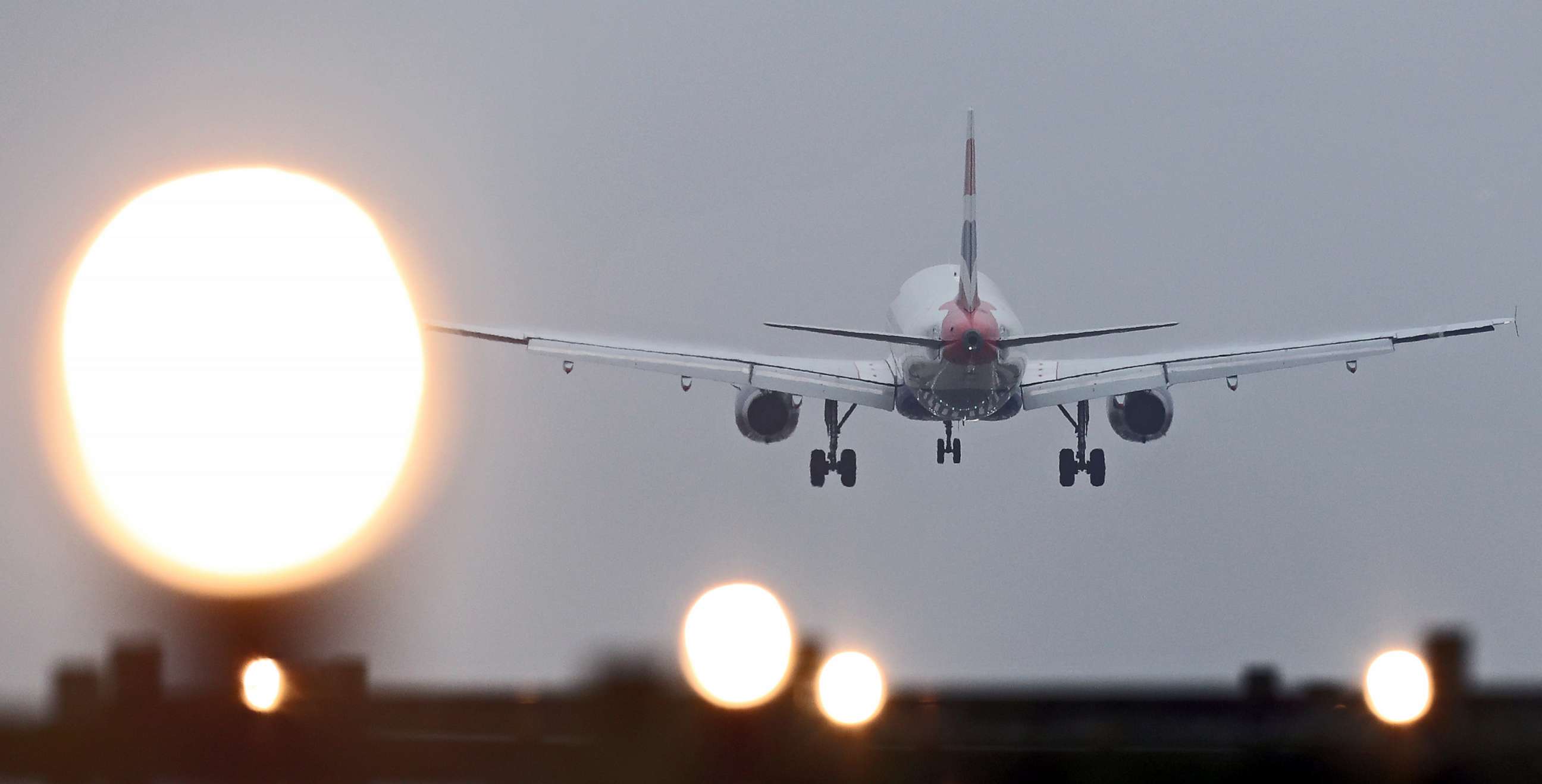 airport runway with plane