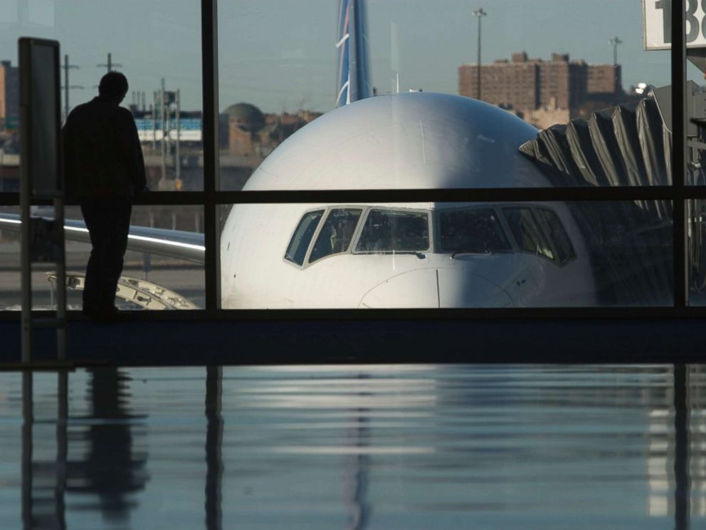 PHOTO: A passenger waits at Newark International Airport.