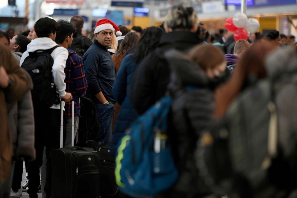 PHOTO: Passengers wait in line at O'Hare International Airport, Dec. 24, 2022, in Chicago.