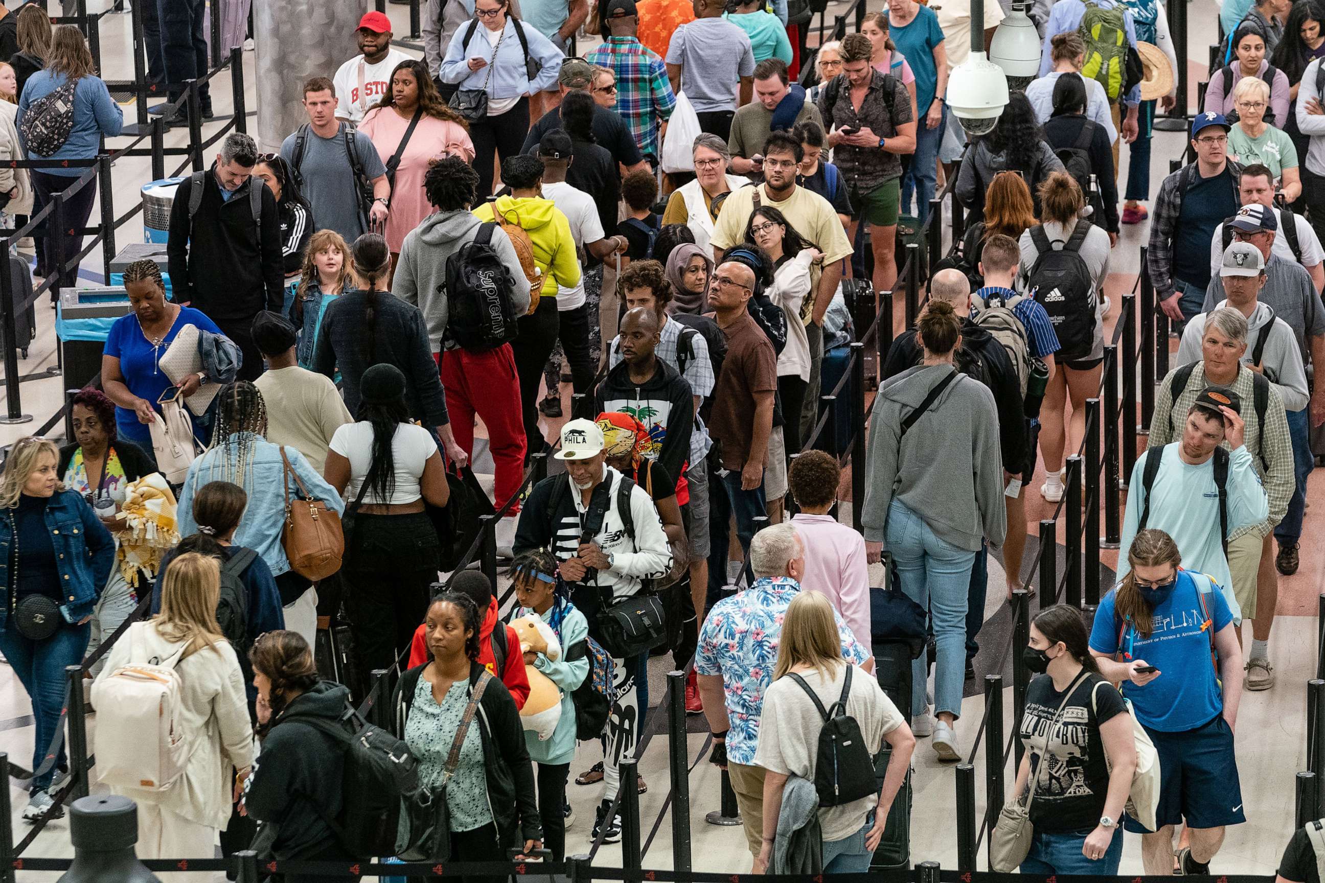 PHOTO: Travelers wait in line at Hartsfield-Jackson Atlanta International Airport, May 25, 2023, in Atlanta, at the start of the summer travel season.