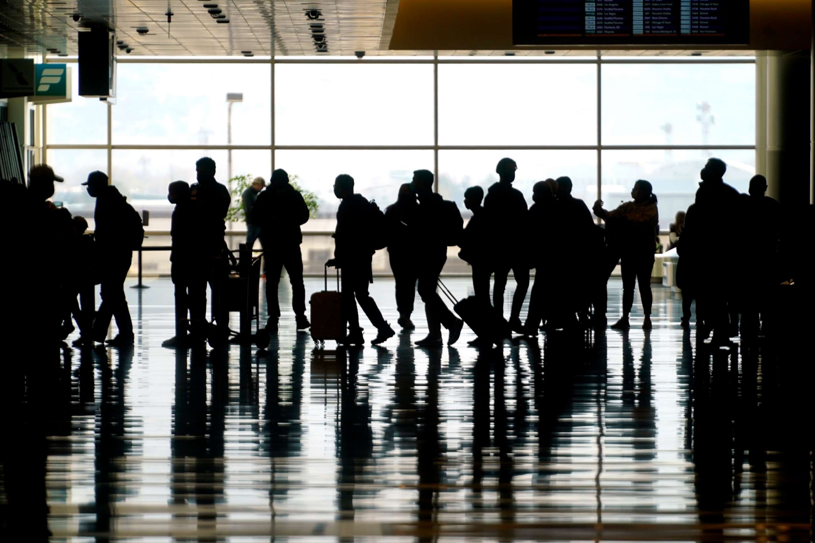 PHOTO: Travelers walk through the Salt Lake City International Airport in Salt Lake City, March 17, 2021.