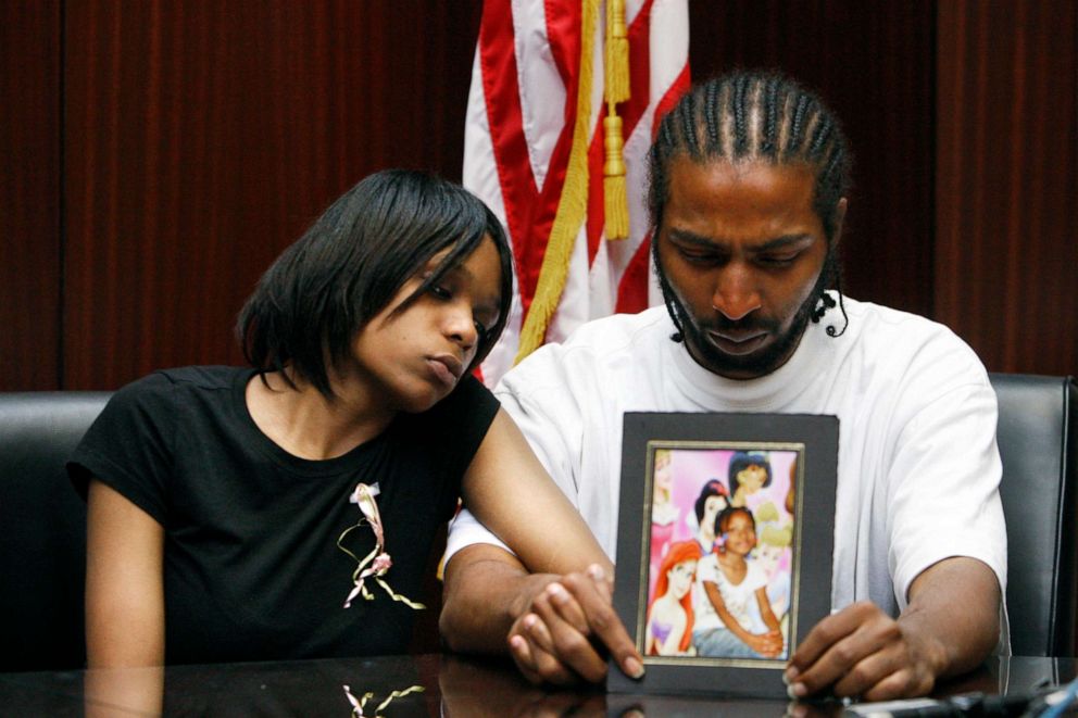 PHOTO: Dominika Stanley, left, the mother of 7-year-old Aiyana Stanley-Jones, sits next to Aiyana's father Charles Jones, who holds a photo of her in Southfield, Mich., May 18, 2010.