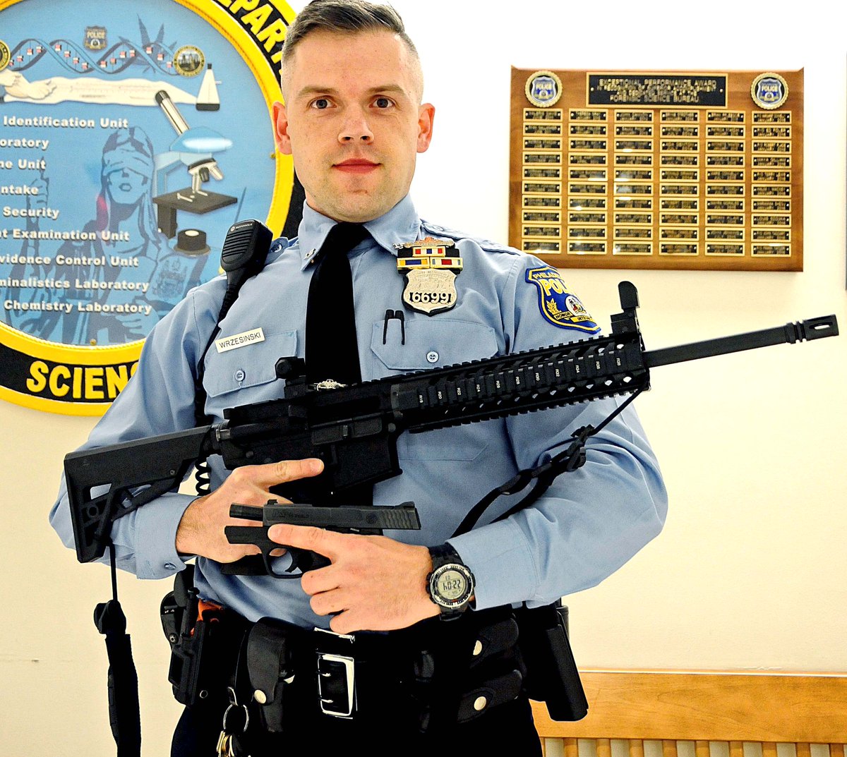 PHOTO: Officer Krzysztof Wrzesinski arrested a 12-year-old for having an AR-15 and his 19-year-old brother for possession of a handgun.