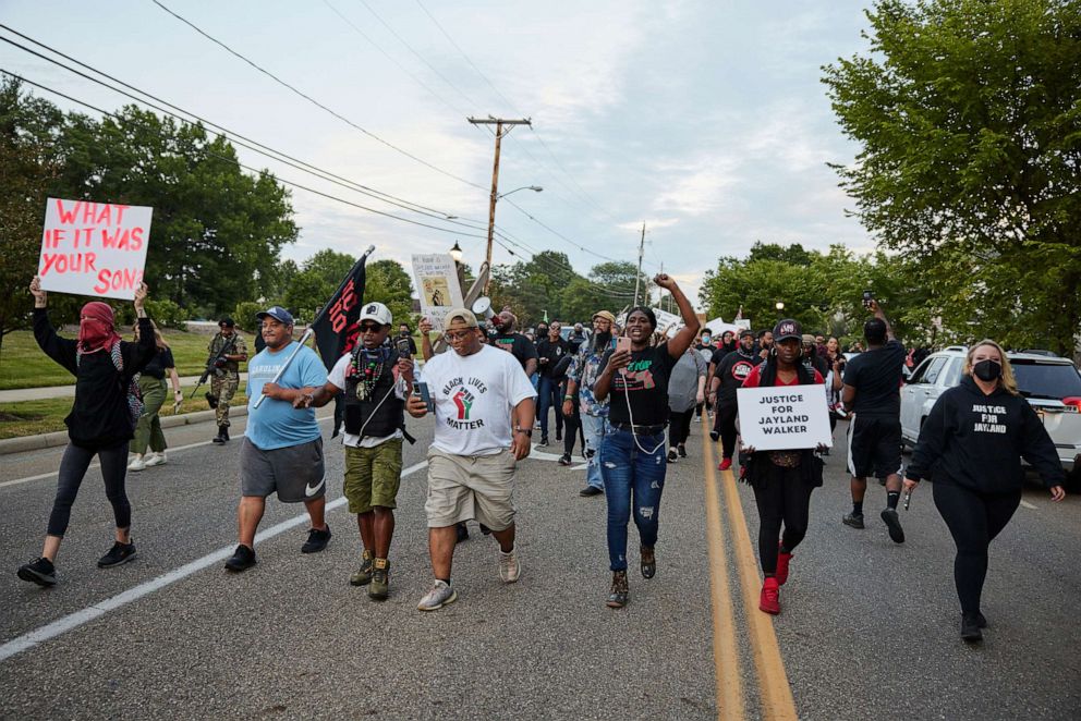 PHOTO: Demonstrators march down E. Wilbeth St. after holding a vigil in honor of Jayland Walker on July 8, 2022 in Akron, Ohio.