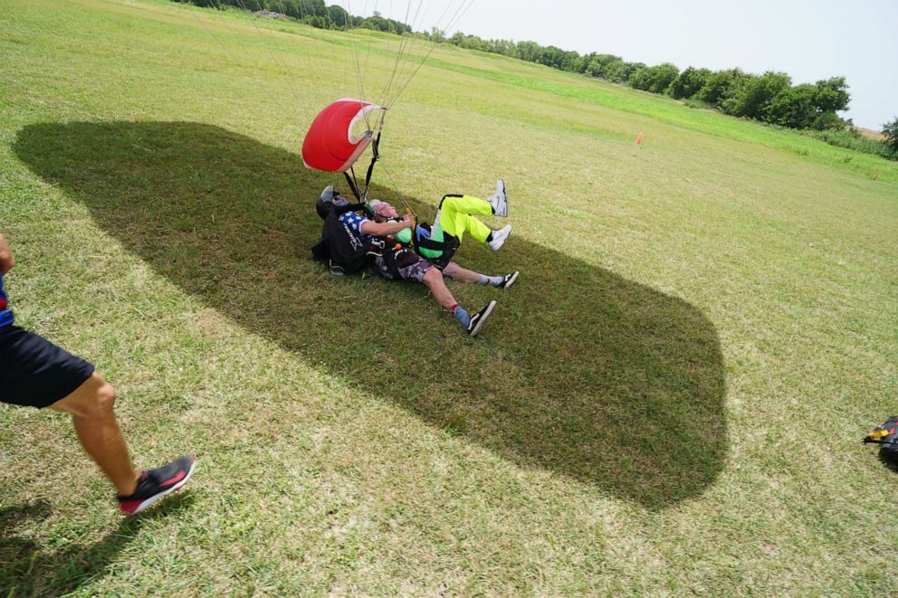 PHOTO: Al Blaschke, 103, lands safely while seeking the Guinness world record for tandem skydiving.