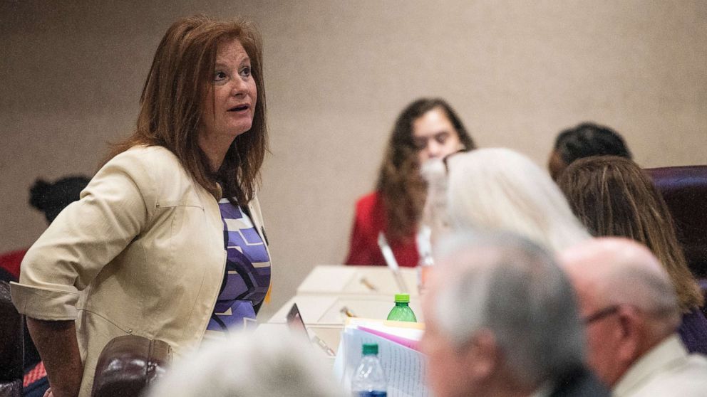 PHOTO: Rep. Terri Collins chats on the house floor at the Alabama Statehouse in Montgomery, Ala., on Tuesday April 30, 2019. Collins is the sponsor of the abortion ban bill.