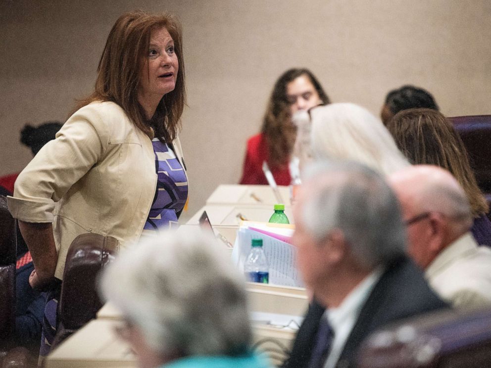 PHOTO: Rep. Terri Collins chats on the house floor at the Alabama Statehouse in Montgomery, Ala., on Tuesday April 30, 2019. Collins is the sponsor of the abortion ban bill.