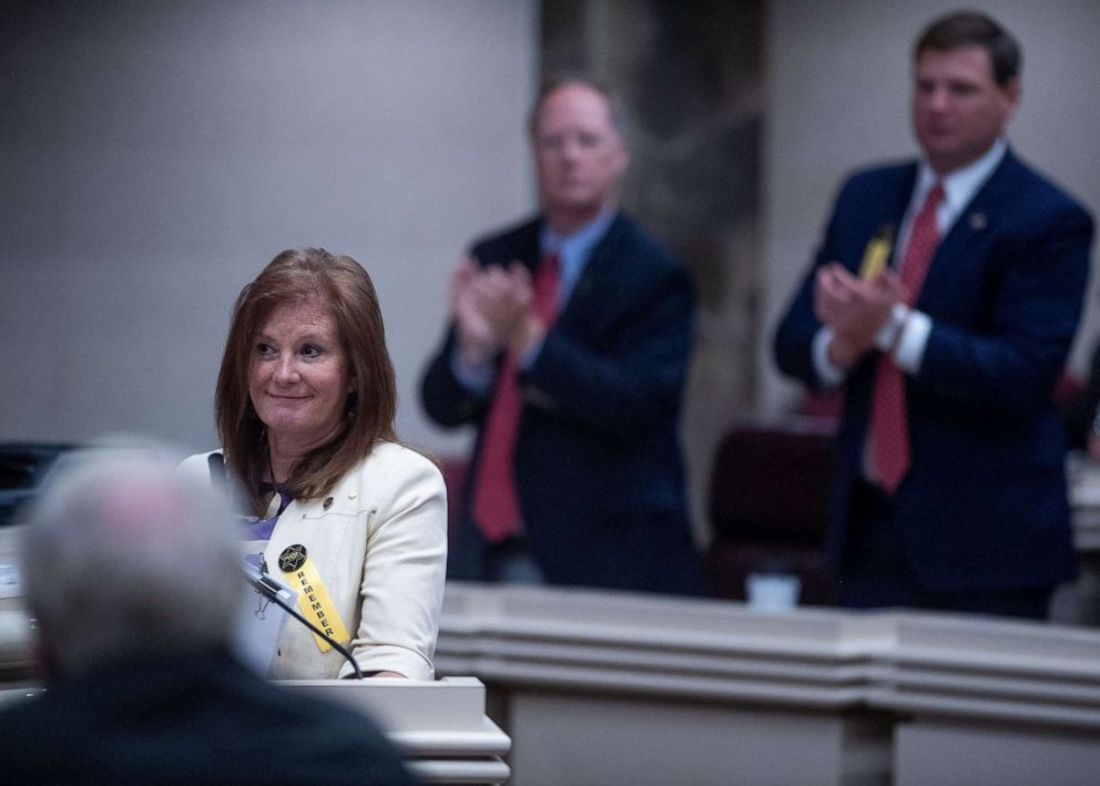 PHOTO: State Rep. Terri Collins gets a standing ovation after her near total ban on abortion bill passed the House at the Alabama Statehouse in Montgomery, Ala., on Tuesday, April 30, 2019.